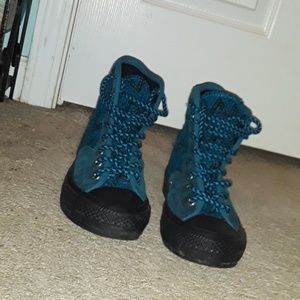 Blue and black Converse in mid condition